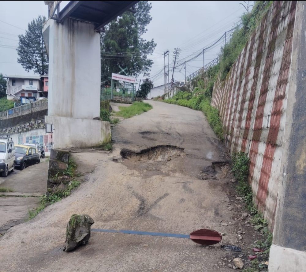 A barricade blocks the Box Cutting road near PWD Junction in Kohima after the Officers' Hill (Thegabakha) Colony Council temporarily closed the stretch due to severe potholes and unsafe road conditions.
